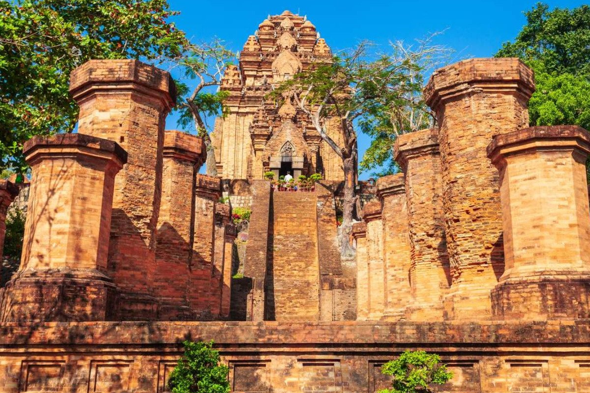 Ruins of the entrance gate at Ponagar Cham Towers with stone steps and ancient brick remains